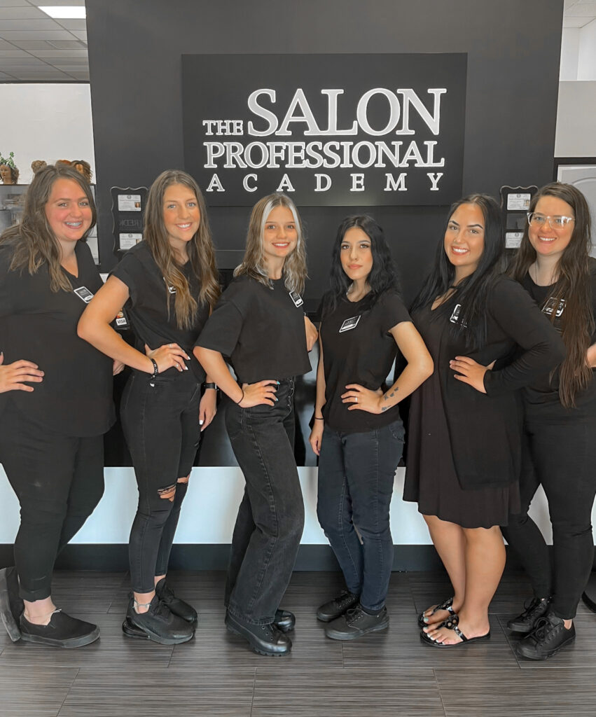 cosmetology students at The Salon Professional Academy on their first day at cosmetology school